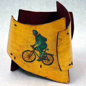wood vessel with bike rider image